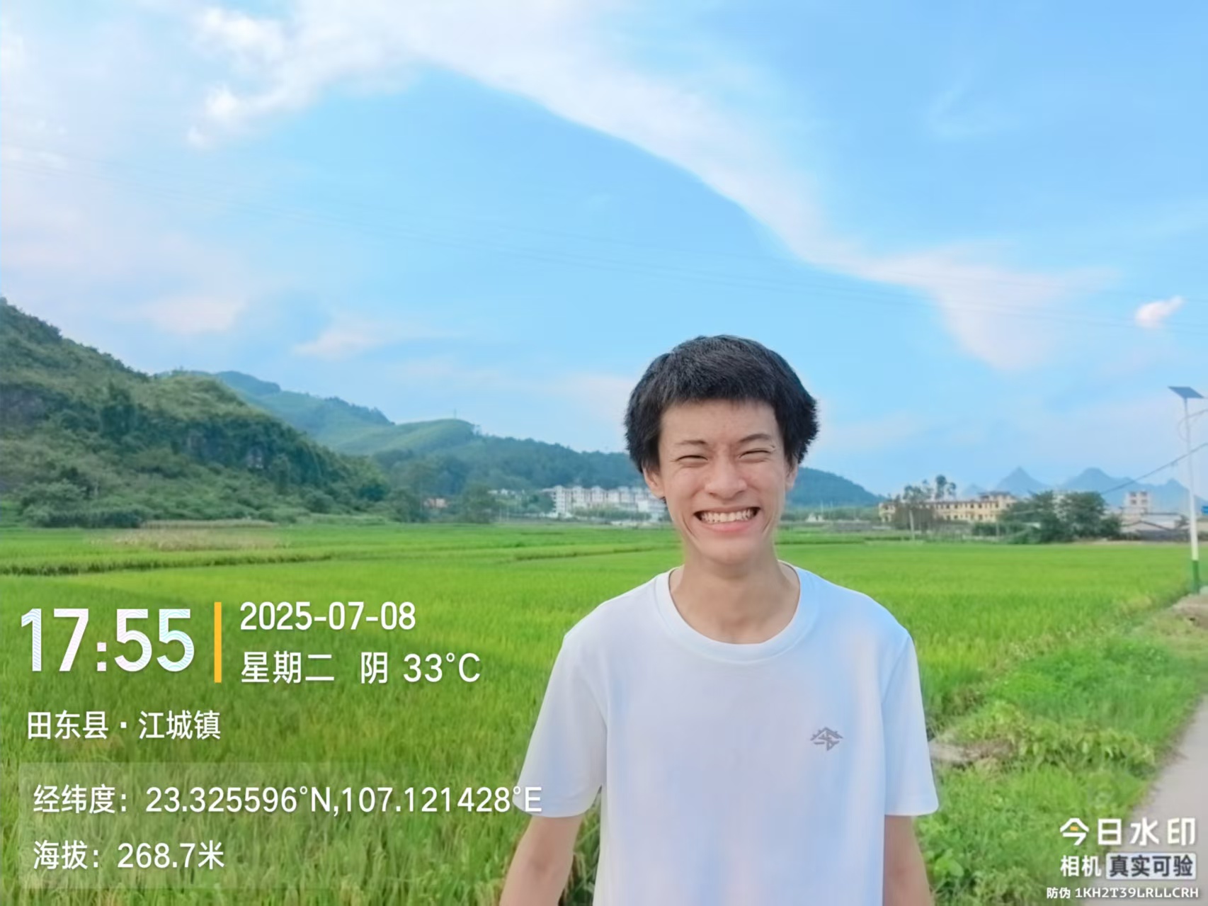 Daniel standing in a rice field